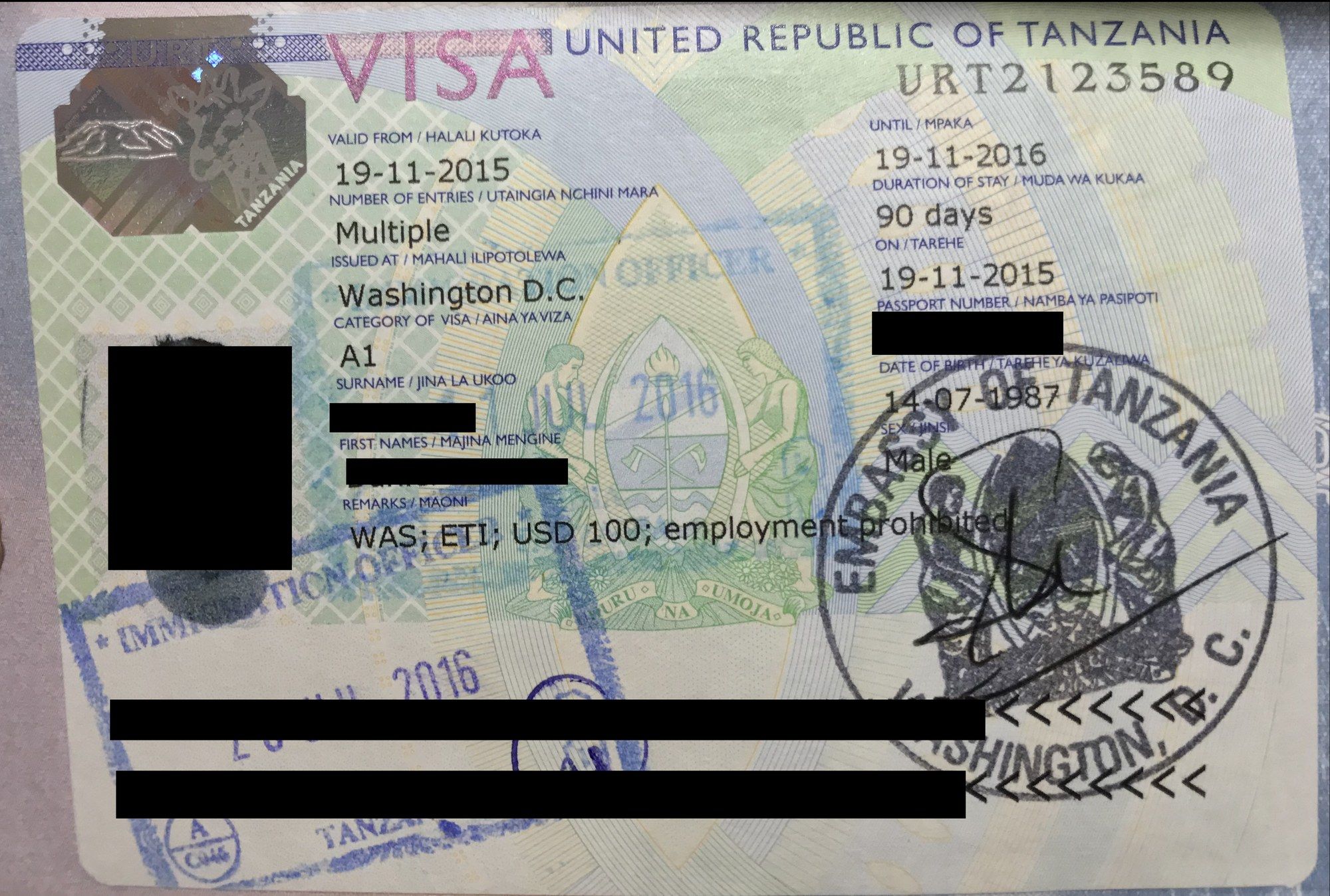 A United Republic of Tanzania visa in a passport, showing entry dates, a 90-day duration of stay and official stamps, with the holder's personal details redacted